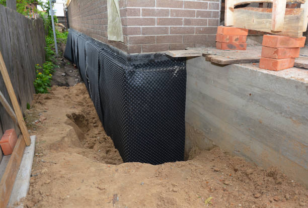 Happy homeowners after waterproofing job in Cullman